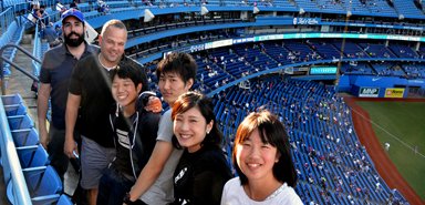 Attending a Toronto's Blue Jays baseball game.